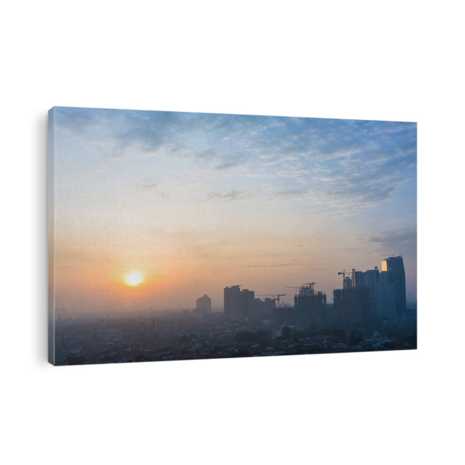 Panoramic view of Jakarta cityscape with skyscrapers and buildings under construction at sunrise