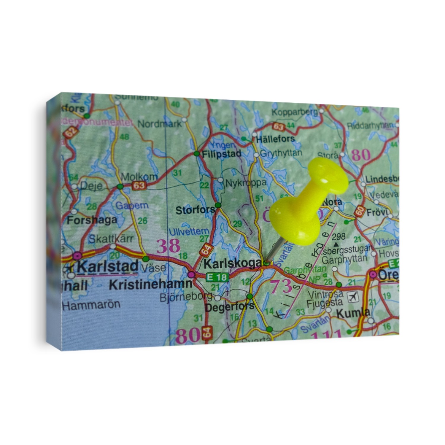 Close up of Karlskoga, a city in Sweden, pinned on a map with yellow pin. Travel concept. Selective focus.