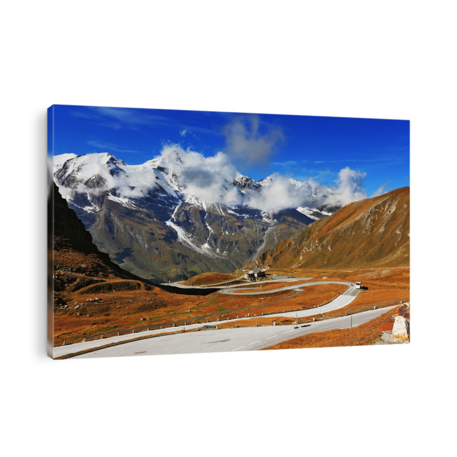 Famous picturesque views of the road in Austrian Alps - Grossglocknershtrasse. Ideal highway winds high in the mountains. The highest mountain peaks covered with fresh snow