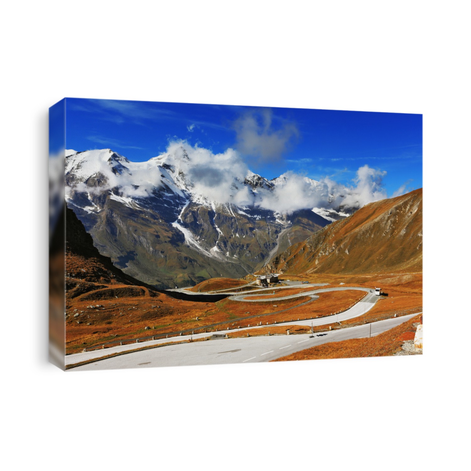 Famous picturesque views of the road in Austrian Alps - Grossglocknershtrasse. Ideal highway winds high in the mountains. The highest mountain peaks covered with fresh snow